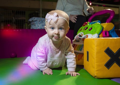 A crawling child playing in the Soft Play area at Flip Out UK