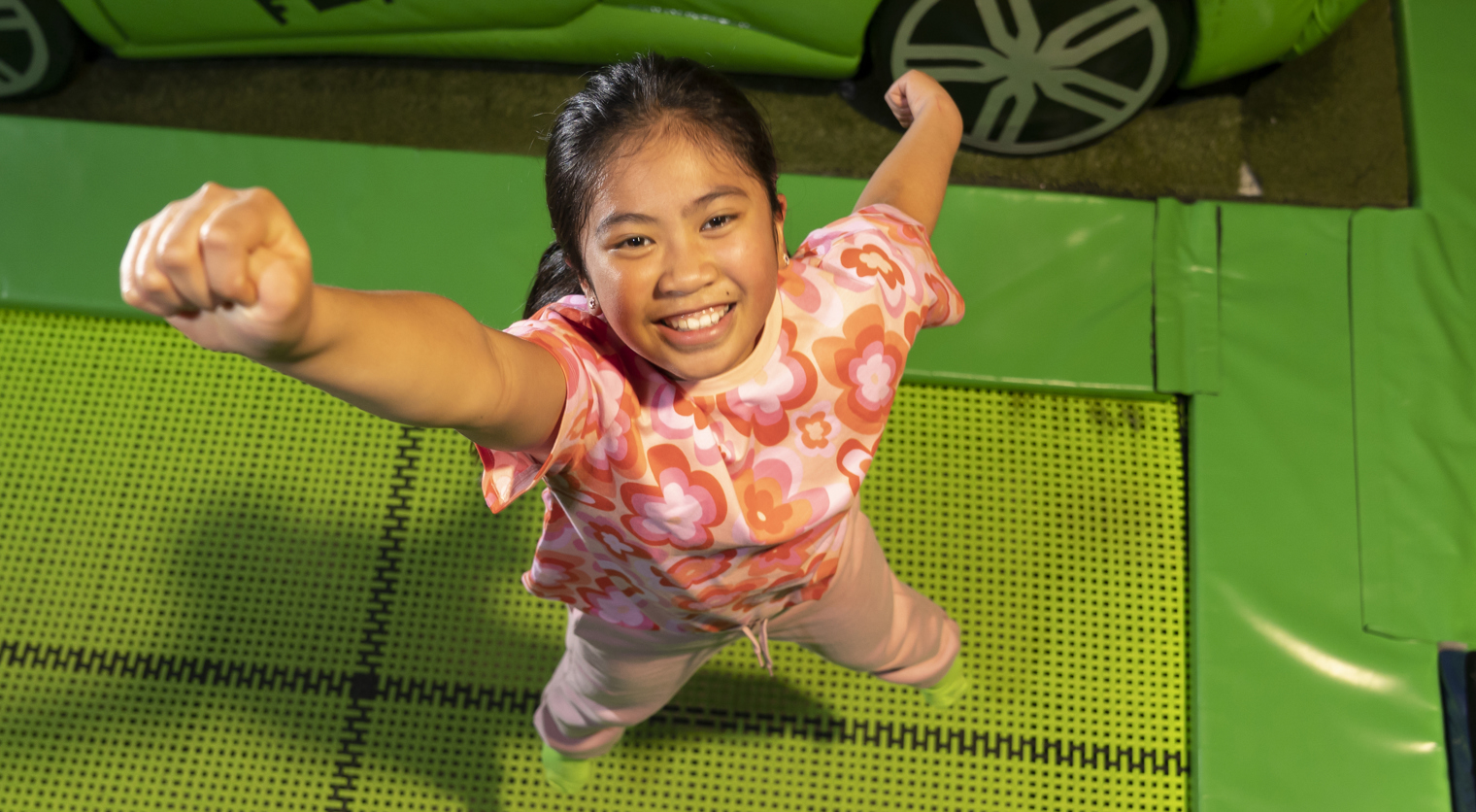A child posing on the Trampolines at Flip Out UK