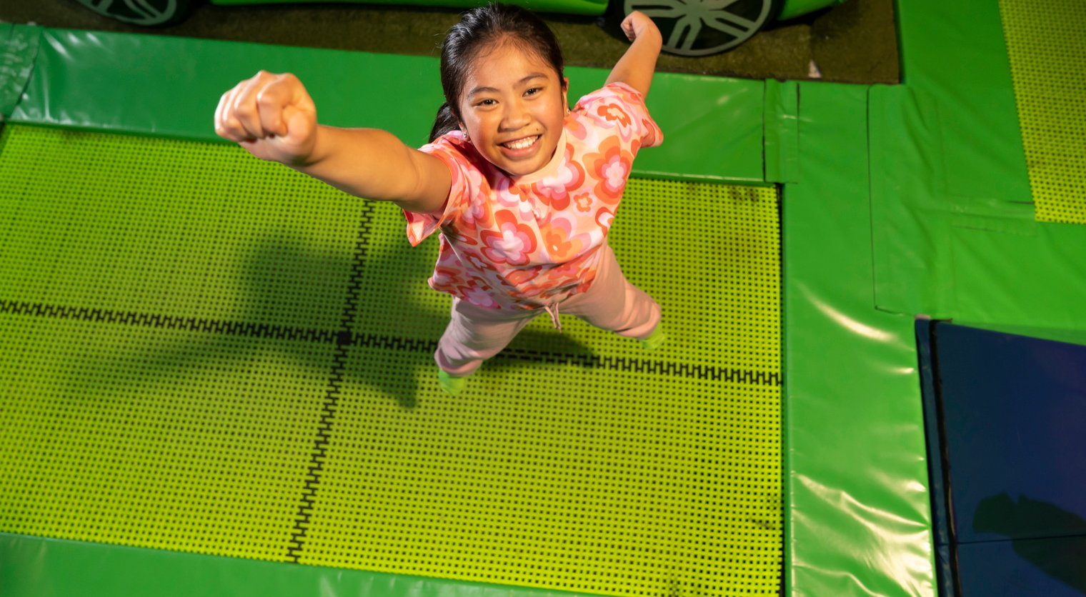 A child posing on the Trampolines at Flip Out UK