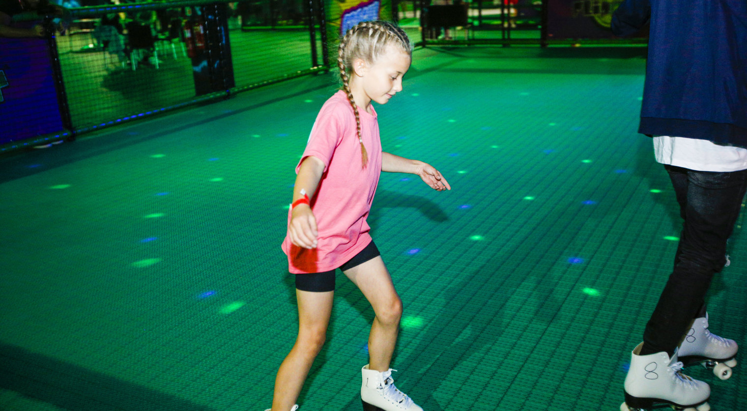 A girl enjoying the Roller Rink at Flip Out UK