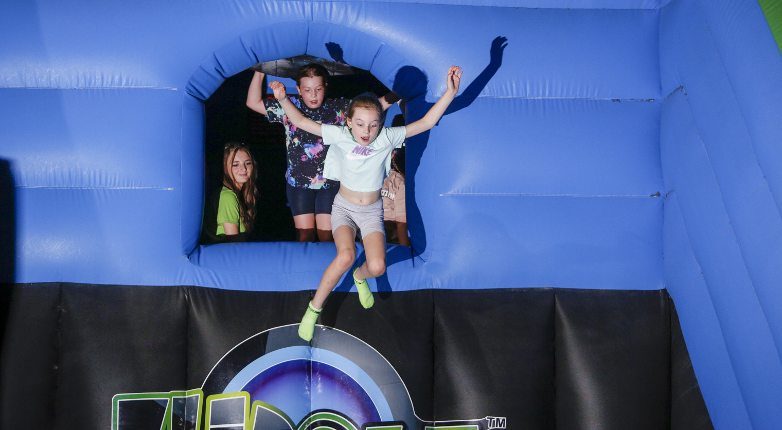 A child leaping into Free Fall on an inflatable at Flip Out UK